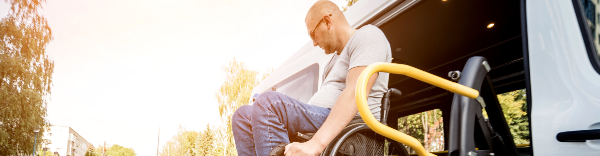 man on wheelchair on board a van